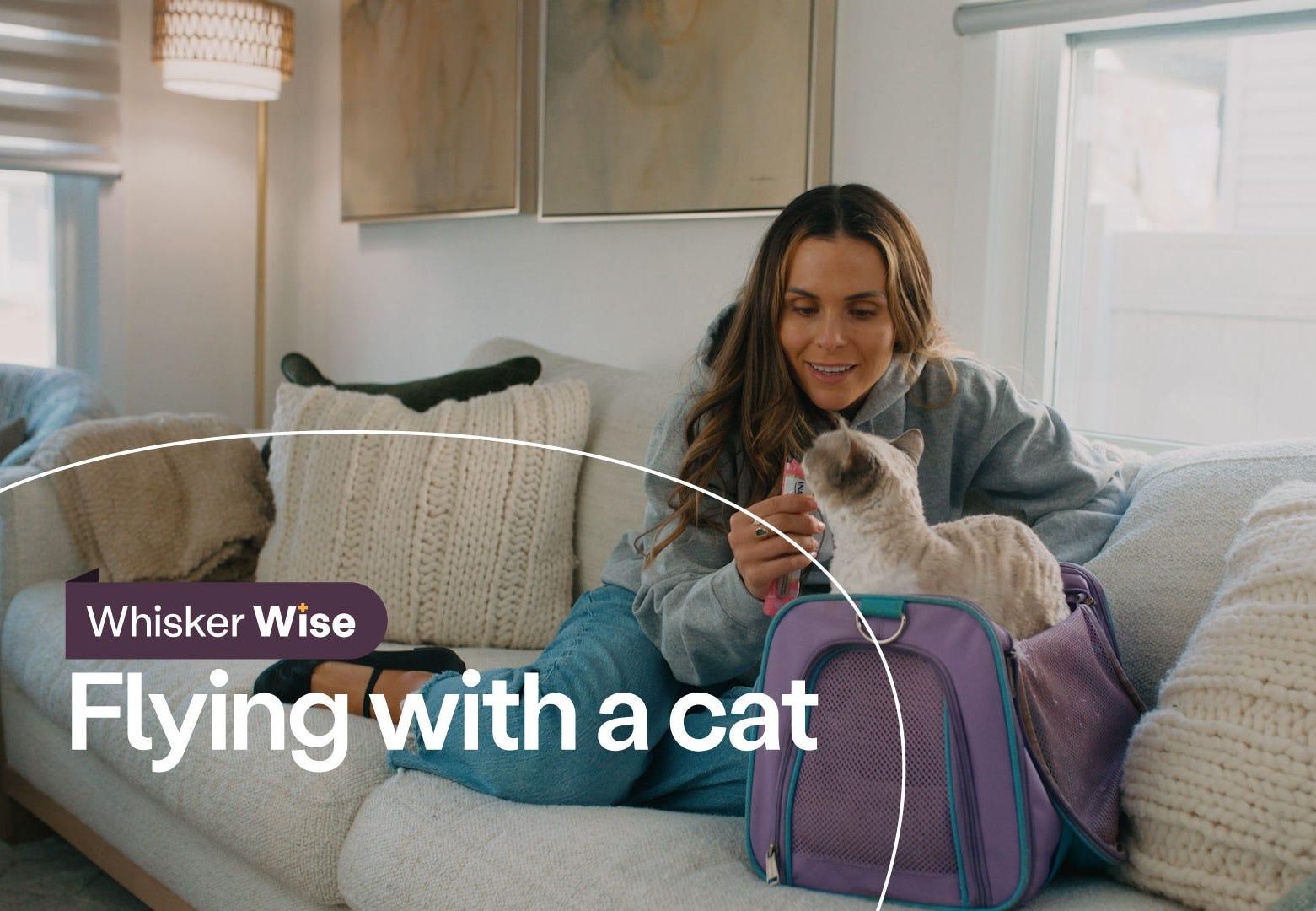Dr. Anna Foster sitting on couch with Devon Rex cat