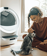 woman petting cat next to Litter-Robot 5 self-cleaning litter box thumbnail