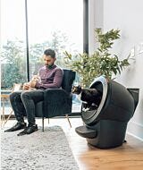 wcom Litter-Robot 4 self cleaning litter box with LitterHopper automatic litter refiller inside a home with multiple cats thumbnail
