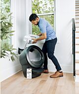 wcom Man adding litter to the LitterHopper attached to Litter-Robot self cleaning litter box thumbnail