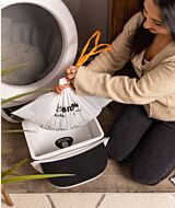 Whisker.com woman removing Litter-Robot Waste Drawer Liner thumbnail