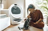 woman petting cat next to Litter-Robot 5 self-cleaning litter box Thumbnail