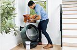 WCOM man pouring Lit into Litter-Robot 4 Thumbnail