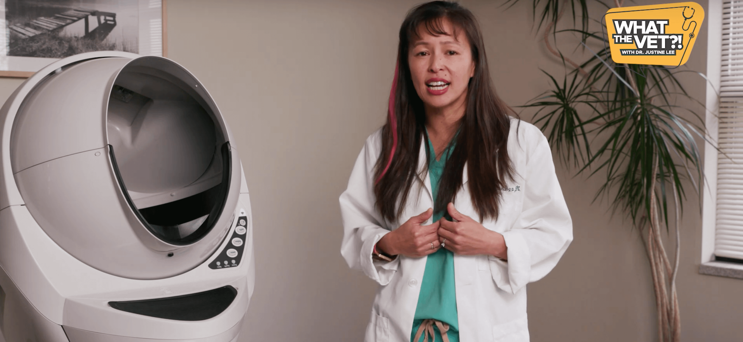 Dr Justine Lee standing near a Litter-Robot