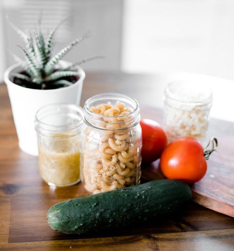 cucumber with kitchen jars, tomatoes, and succulents - why are cats afraid of cucumbers