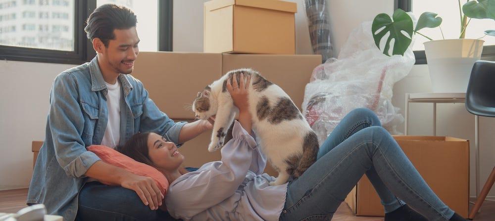 family introducing cat to new home