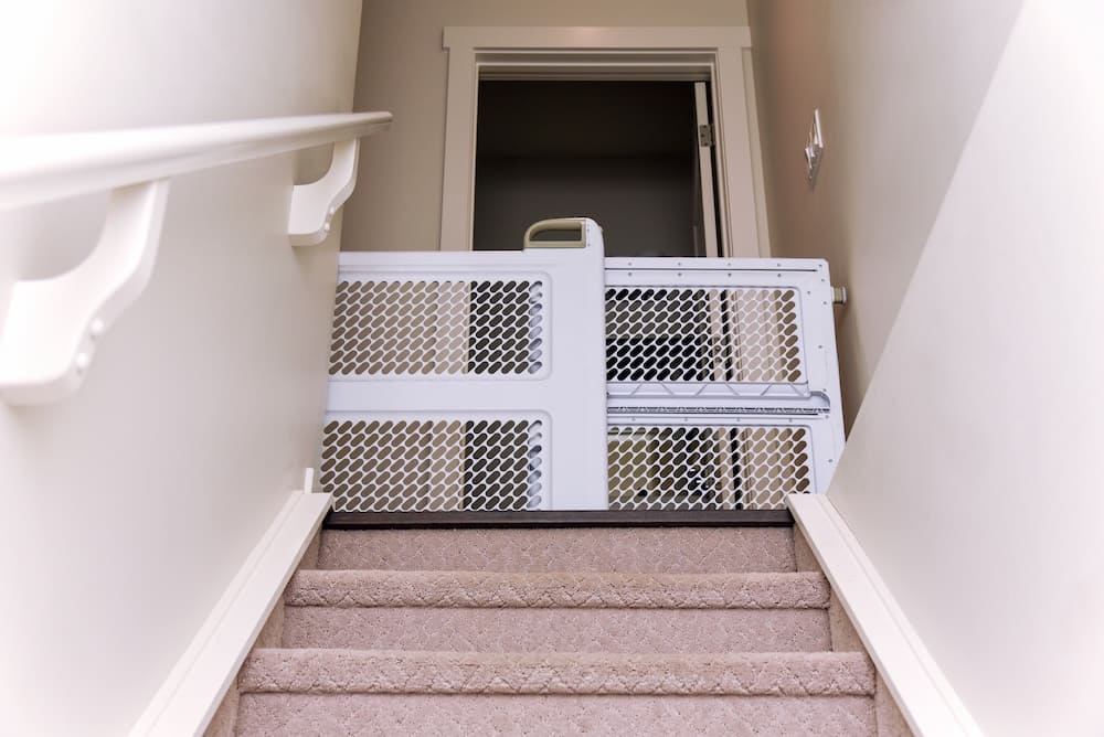 pet gate at stairs to stop disabled cats from injuring themselves