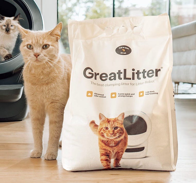 orange tabby with bag of GreatLitter