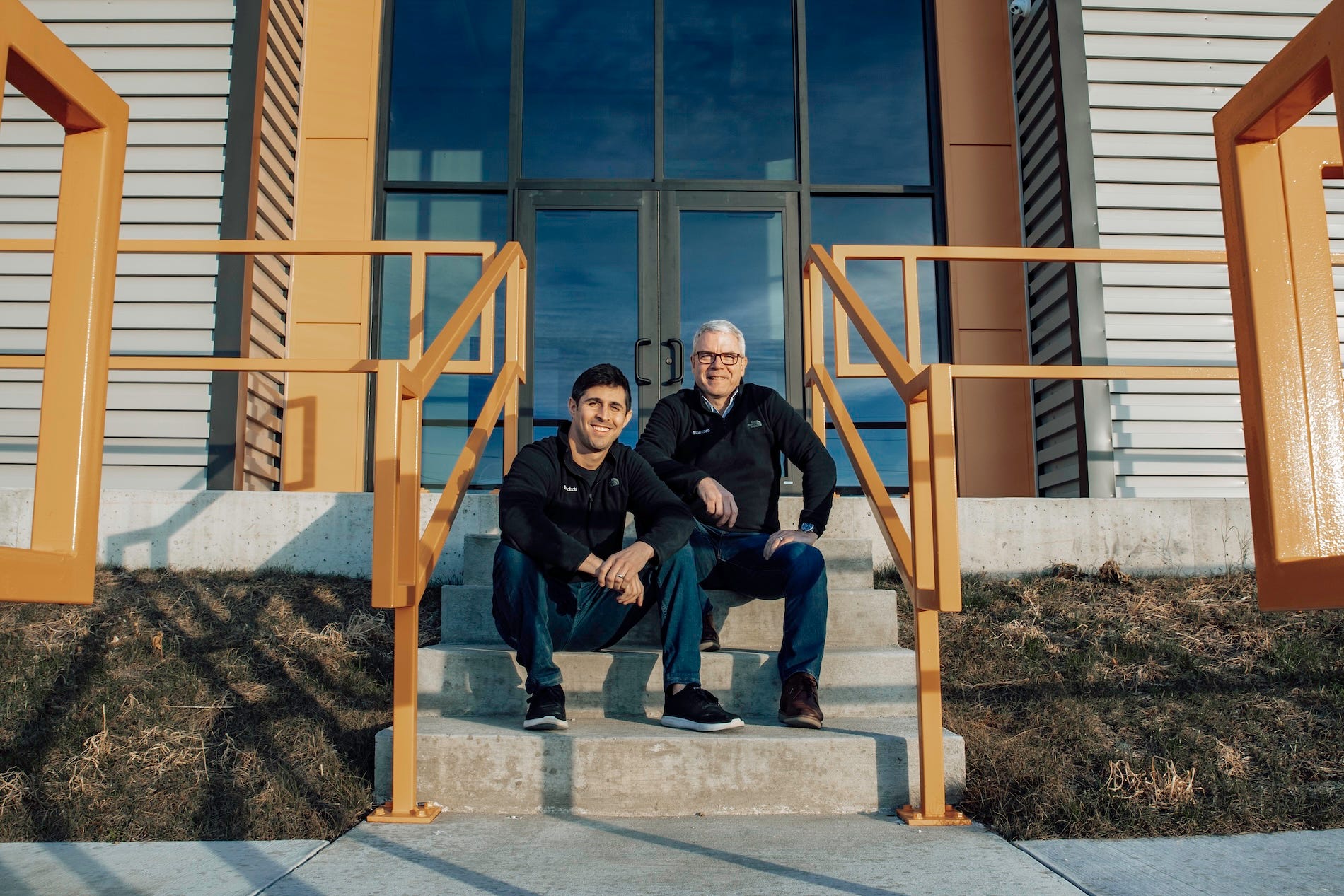 Brad Baxter Founder of Whisker and Jacob Zuppke CEO of Whisker sitting on stairs
