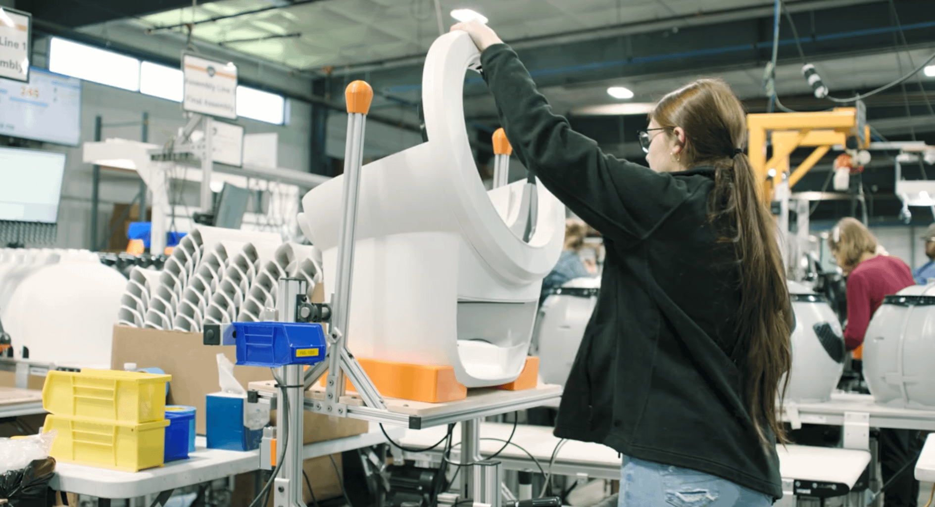 Whisker employee assembling Litter-Robot in USA