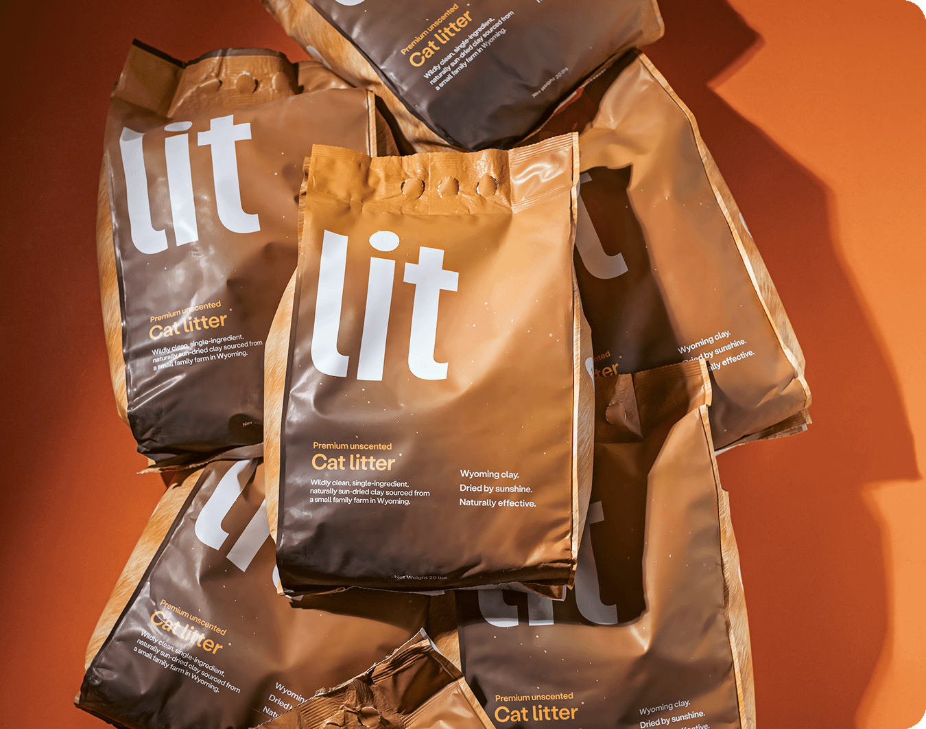 bags of Lit cat litter scattered on top of each other