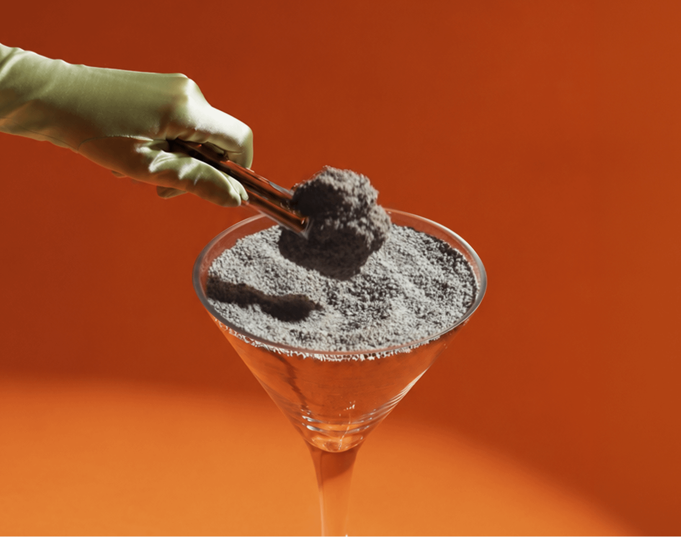 martini glass with clay litter clump