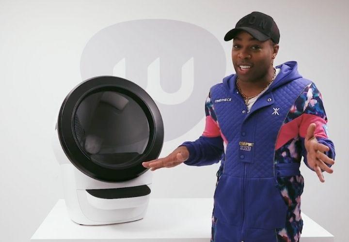 Todrick Hall next to Litter-Robot 4 self cleaning litter box