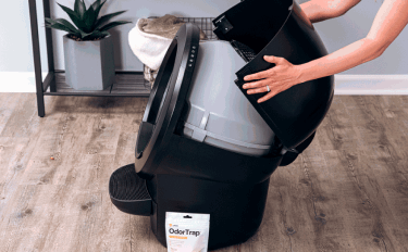 A person installing OdorTrap to their Litter-Robot 4