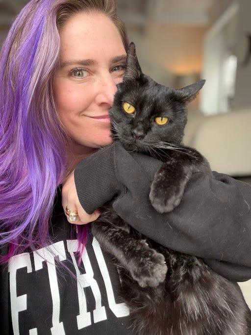 Nikki Sapiro Vinckier, PA-C OB-GYN with her black cat Shadow