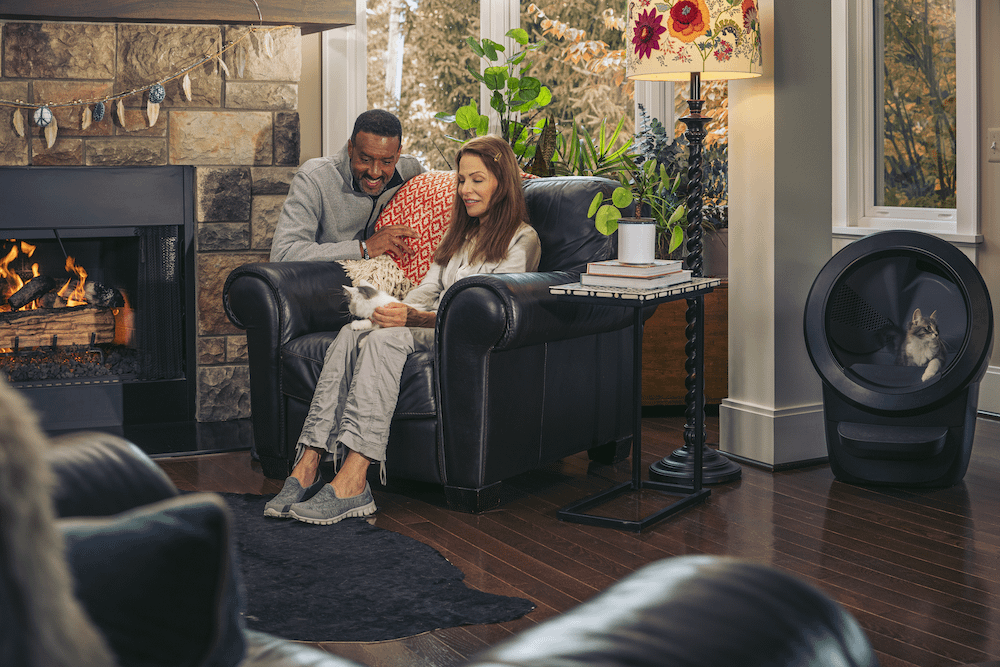 Couple with cat and cat using Litter-Robot 4