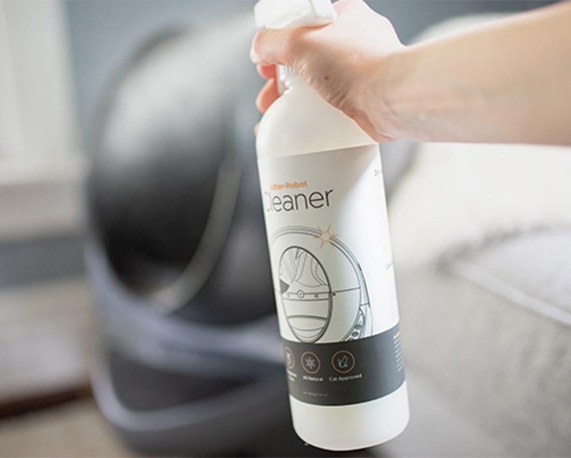 Spraying the Litter Robot cleaner spray