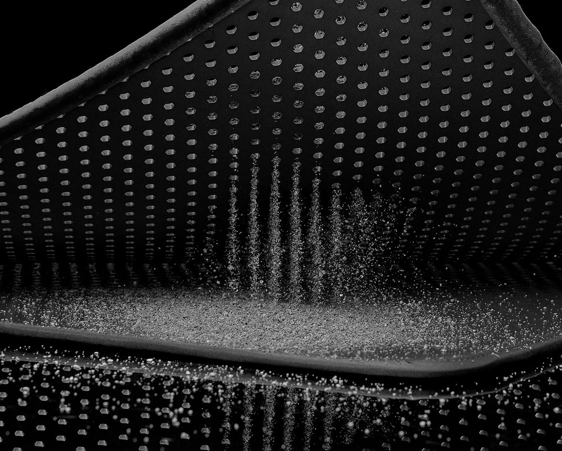 litter falling through litter trap mat