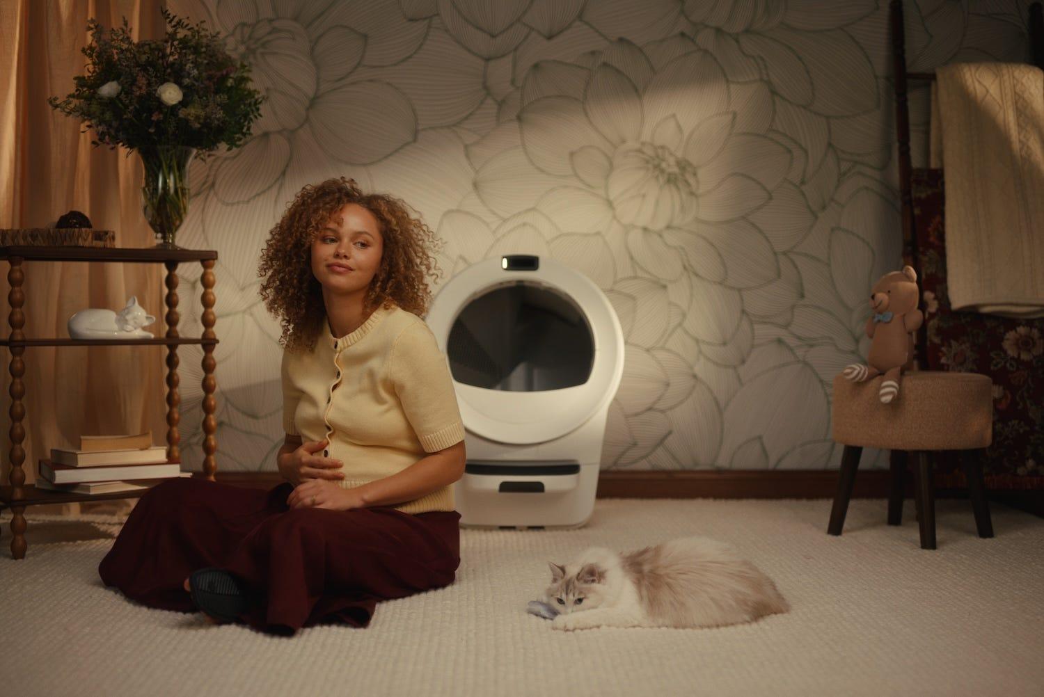pregnant woman next to Ragdoll cat in front of self-cleaning litter box Litter-Robot 5 Pro