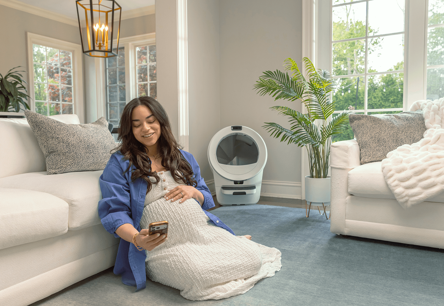 pregnant woman on Whisker app near Litter-Robot