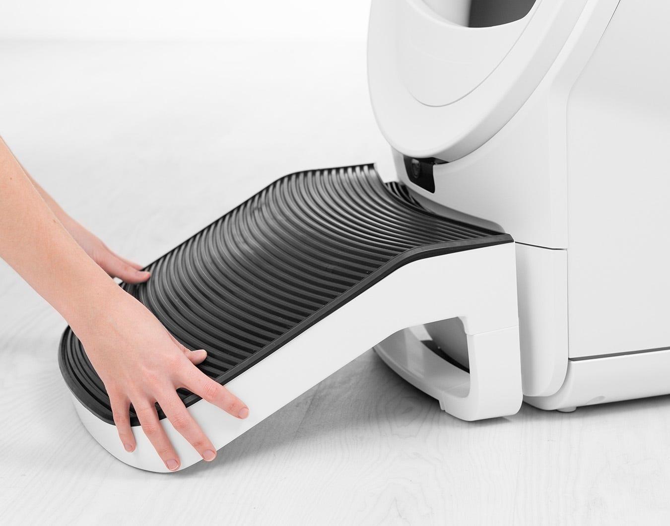Litter-Robot 4 next to a traditional litter box