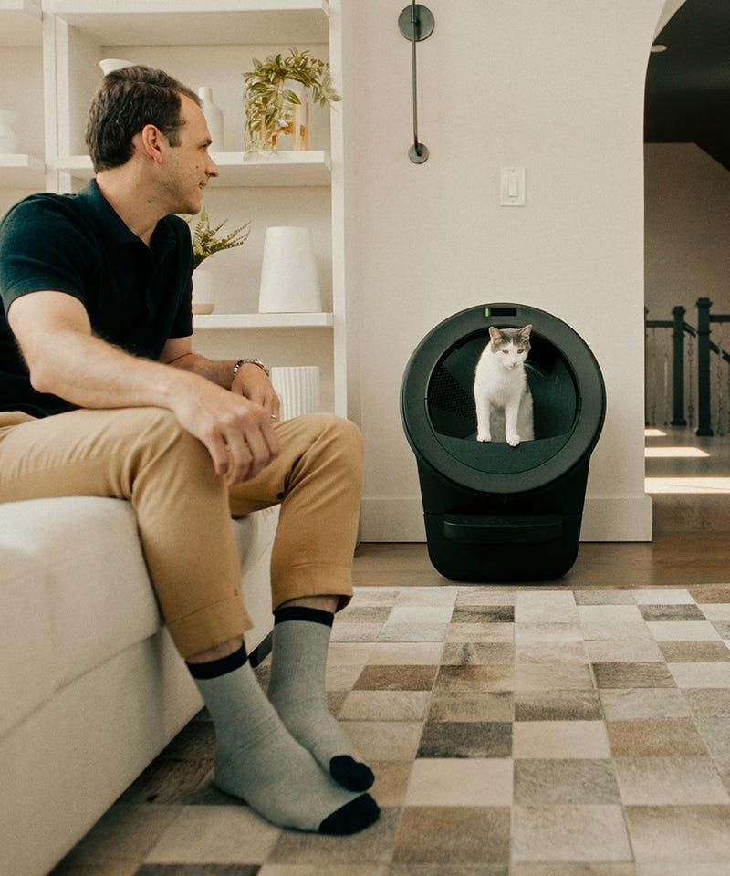 man and cat with Litter-Robot