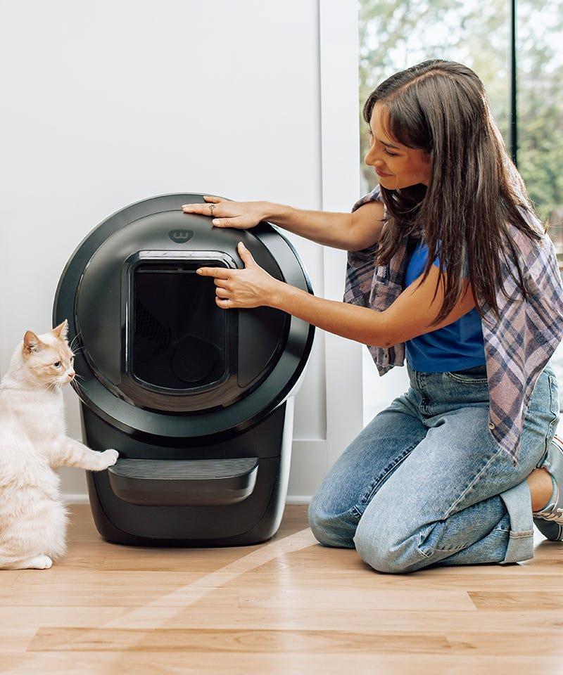 woman and cat with Litter-Robot