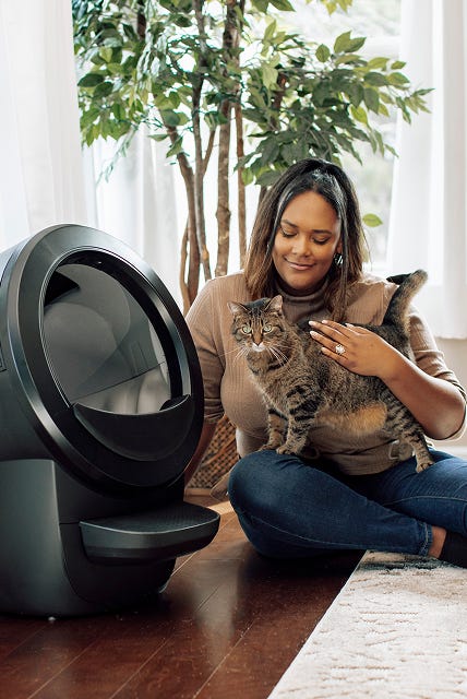 Sam and tabby cat using Litter-Robot 4
